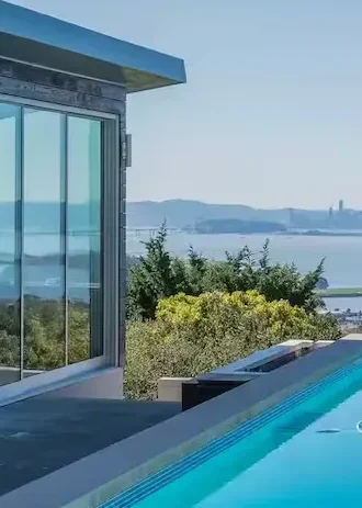 Bay Area residential property with swimming pool and large glass window installation